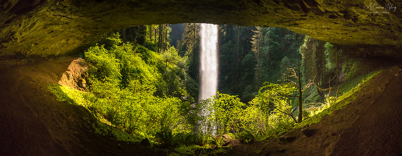 a view of a waterfall from inside a cave. It looks like nature's eye. waterfall hikes in oregon