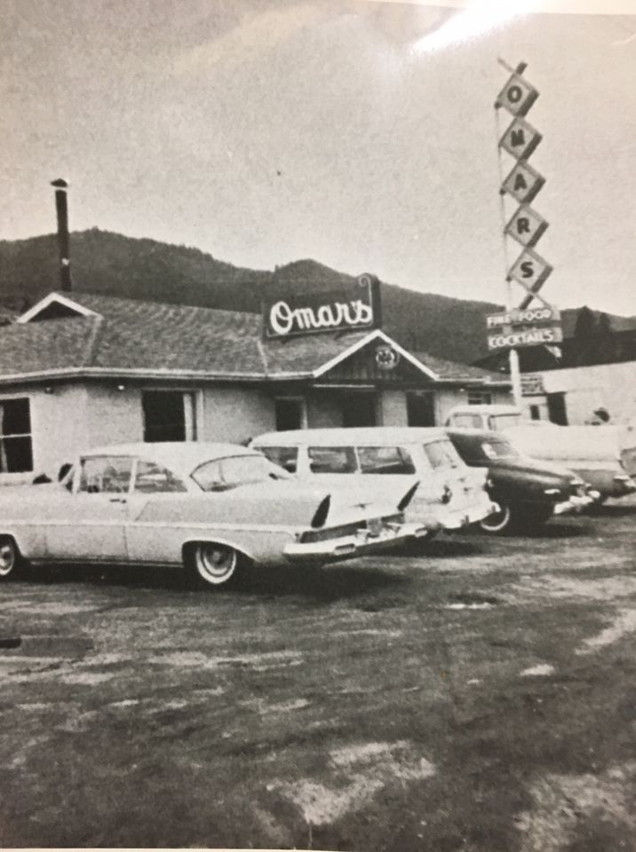 a black and white photo of the outside of Omar's restaurant