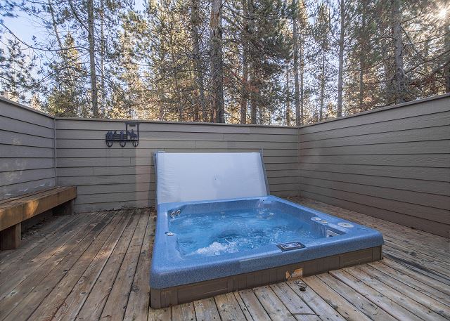 A private hot tub on a deck at a cabin in Sunriver Oregon near Bend.