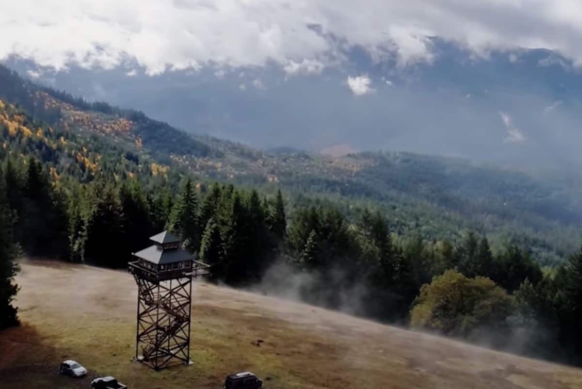 An aerial view of the mountains and lookout tower airbnb in Oregon