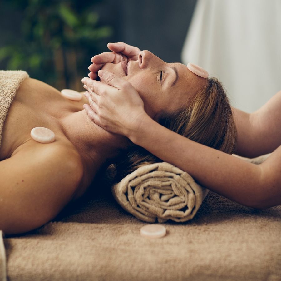 Spa On Oregon Coast - A woman gets a Himalayan salt stone Massage