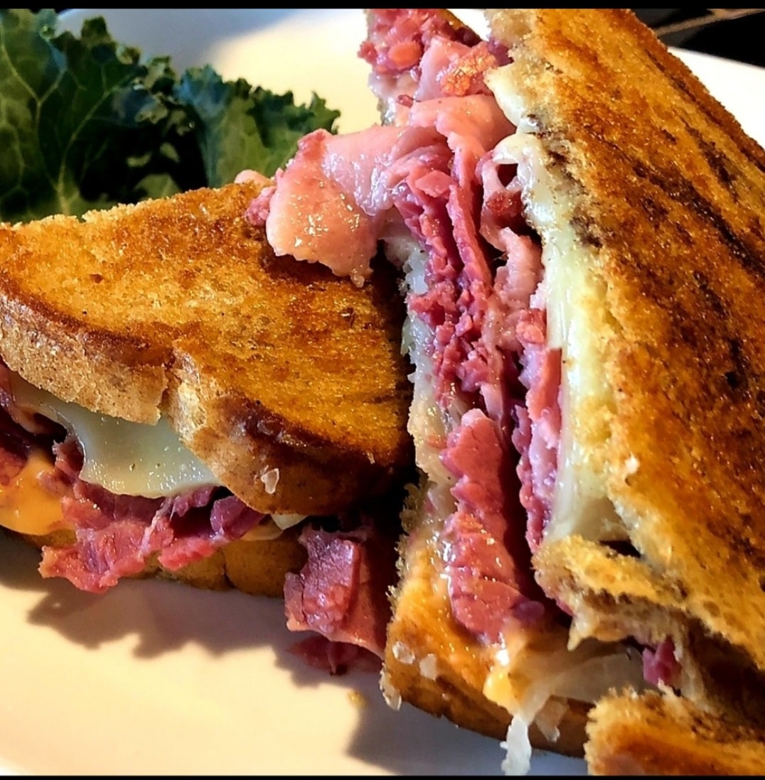 A sandwich with a lot of meat and cheese on toasted bread at the Smoky Hearth Bar and Grill in Sandy, Oregon