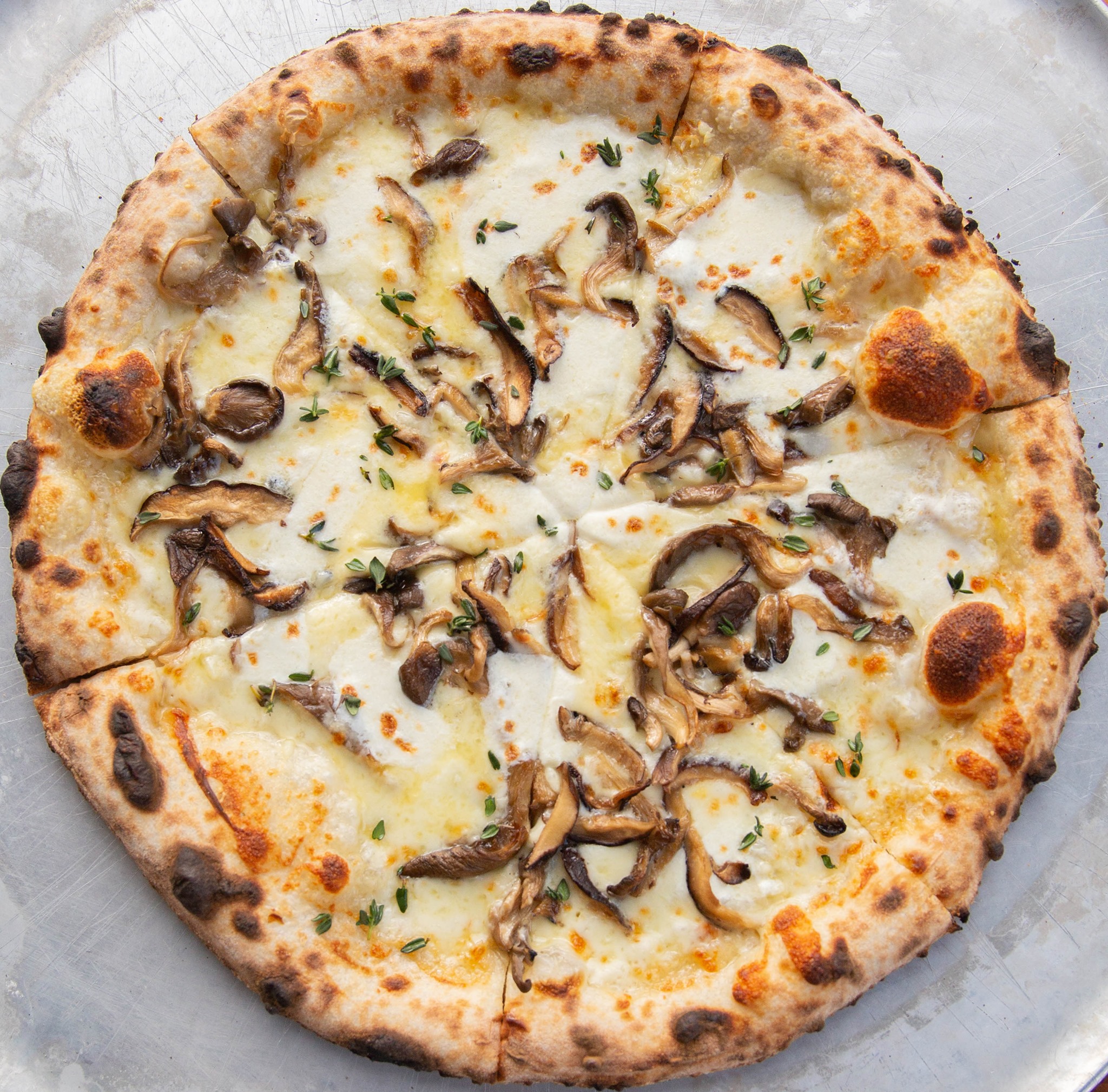 A delicious mushroom pizza from Ken's Artisan Pizza in Portland Oregon.