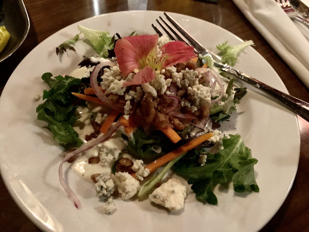 A fine looking salad with a pink flower on top at Cimmityotti's in Pendleton.