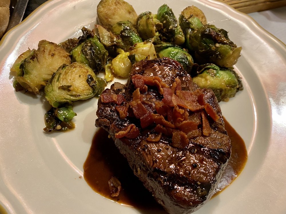 A sirloin with bacon on top with seared brussel sprouts. Looks amazing!