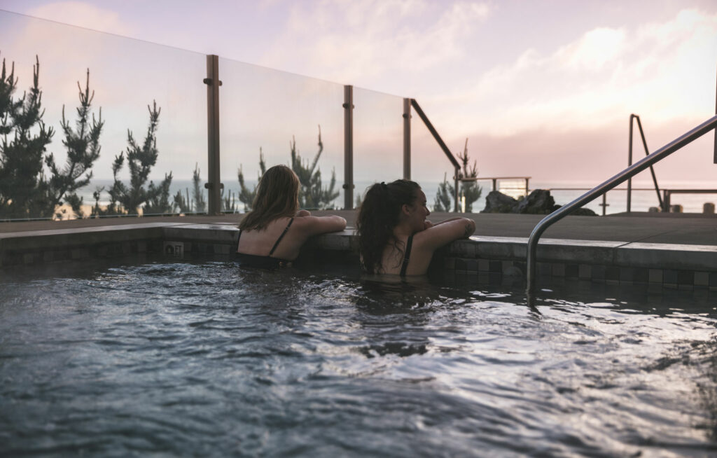 Two people checking out the view from the water at the spa.