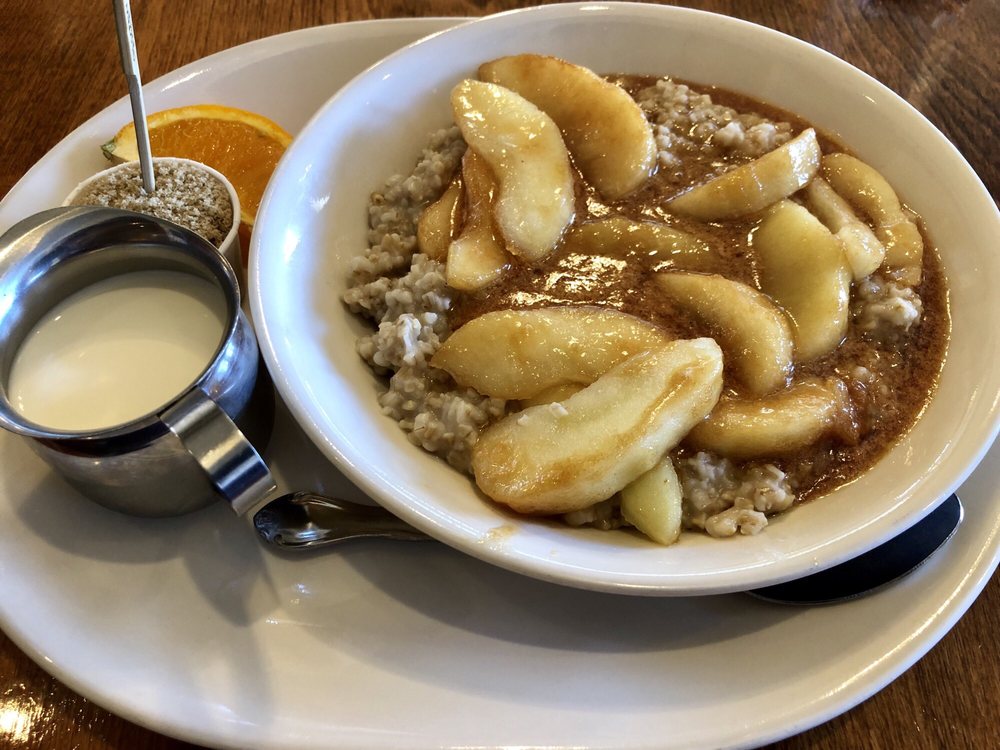 A huge bowl of steel cut oatmeal with warm apples and cinnamon.