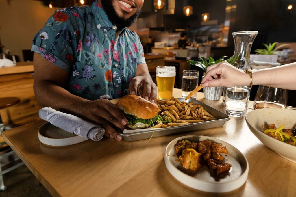 Two people enjoy a meal at Boxwood Kitchen.