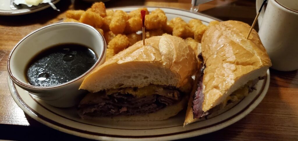 A delicious looking French dip sandwich.