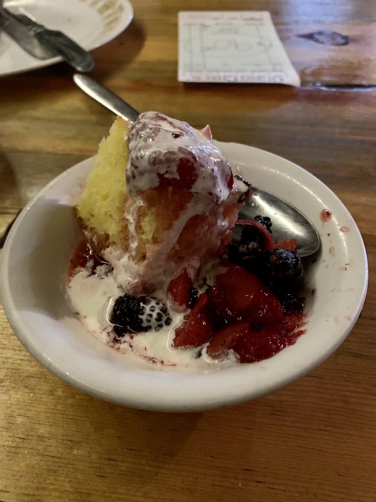 Desert. It looks like some kind of shortcake with various red and black berries and sauce. Looks delicious!