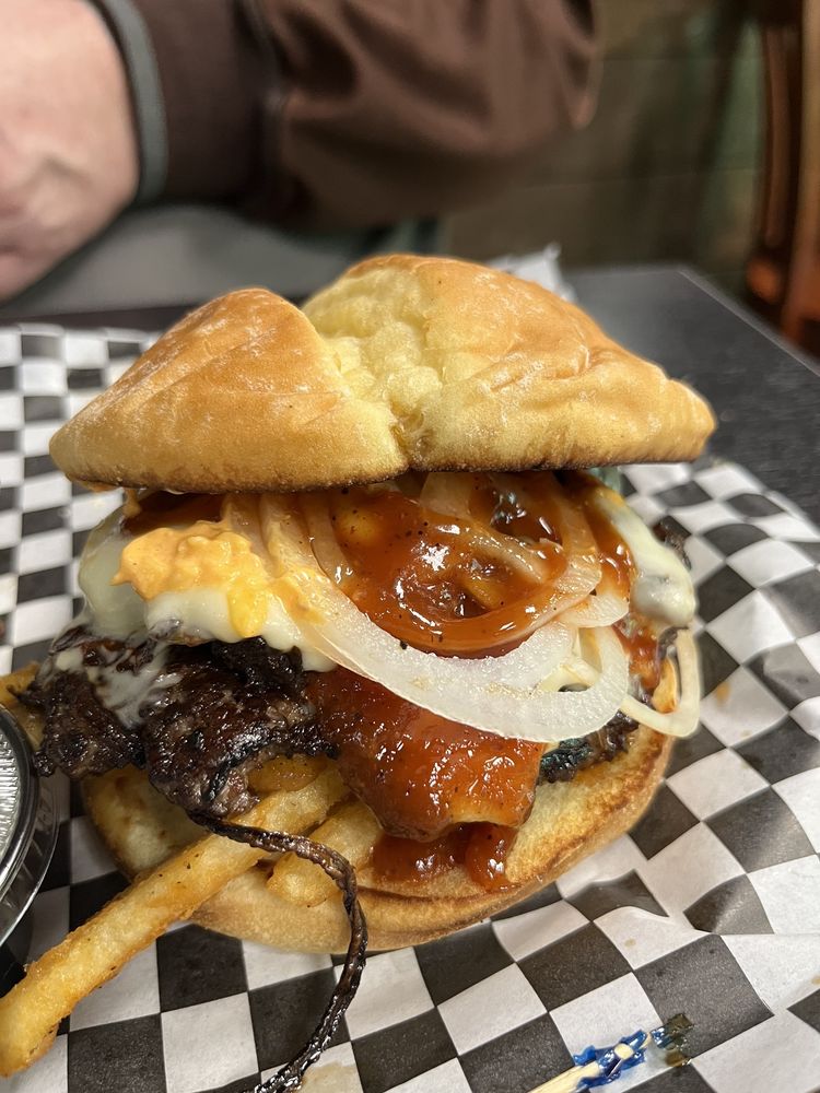 The Holy Smokes Smash Burger. It looks messy and delicious!