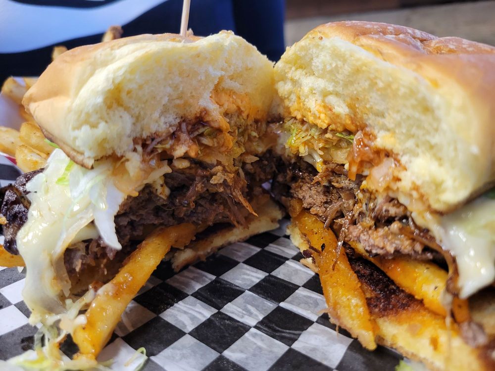 The Holy Smokes Smash burger cut in half. It looks delicious!