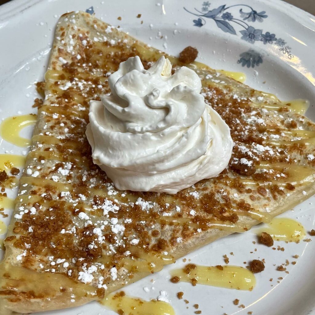 A delicious looking crepe drizzle din sauce with whip cream on top at Frog And Snail.
portland oregon, best restaurants, 2024, where to eat, best brunch, food and drink, bars, pizza, sushi, thai food, PDX, foodie heaven